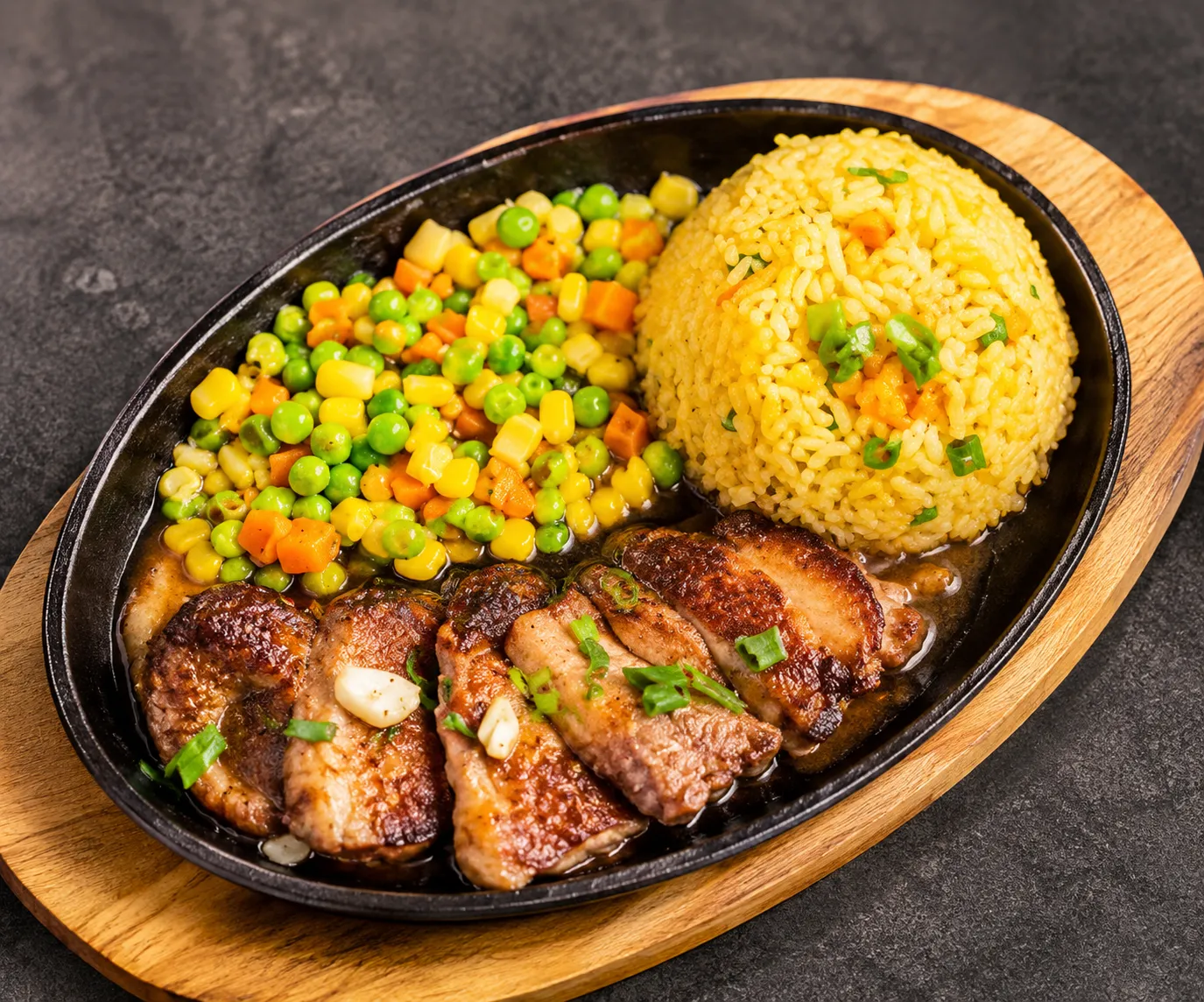 Filipino rice meal served with sides at Mar's Sisig Winnipeg