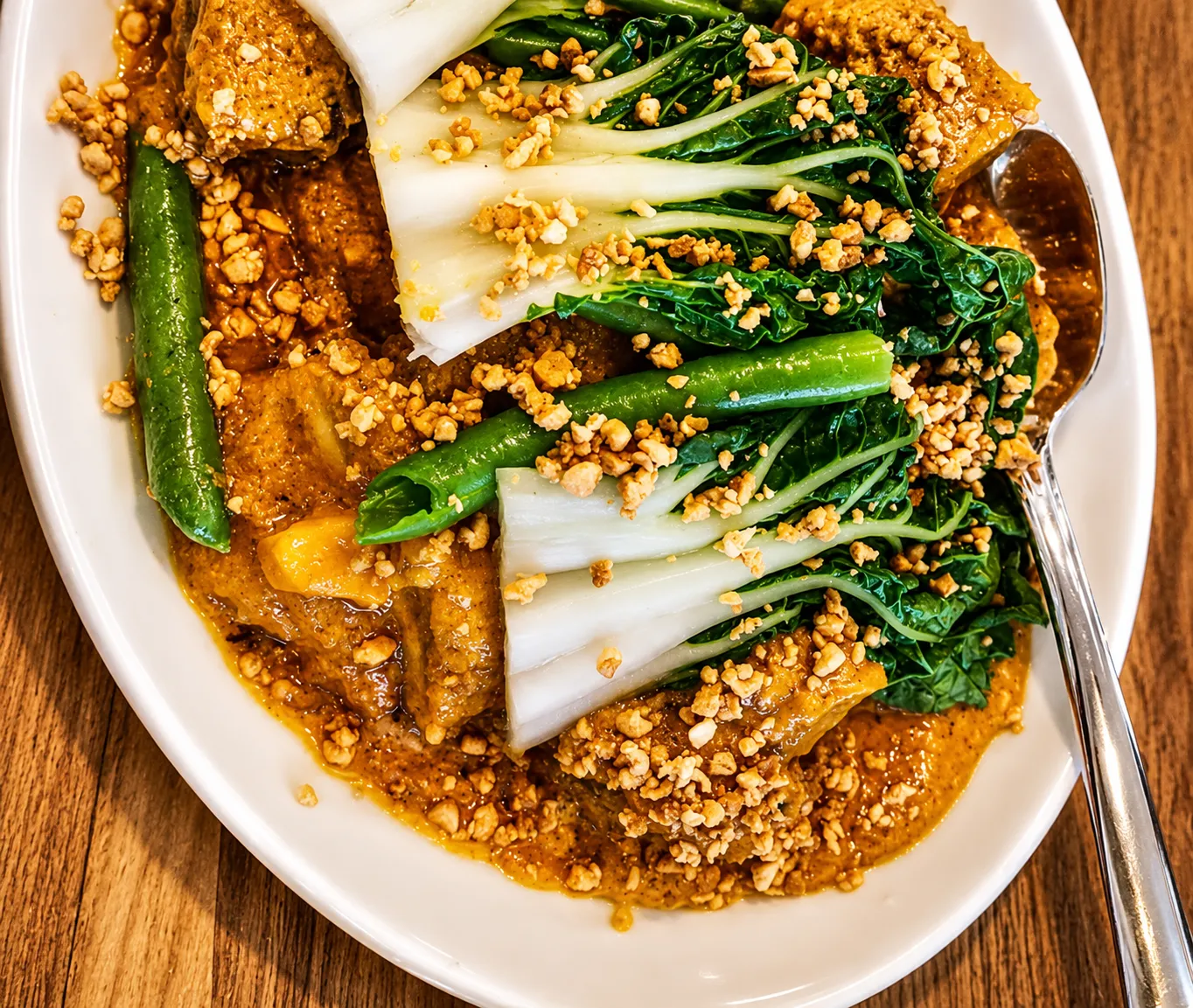 Beef Kare-Kare Filipino peanut stew with tender beef and vegetables at Mar's Sisig restaurant in Winnipeg